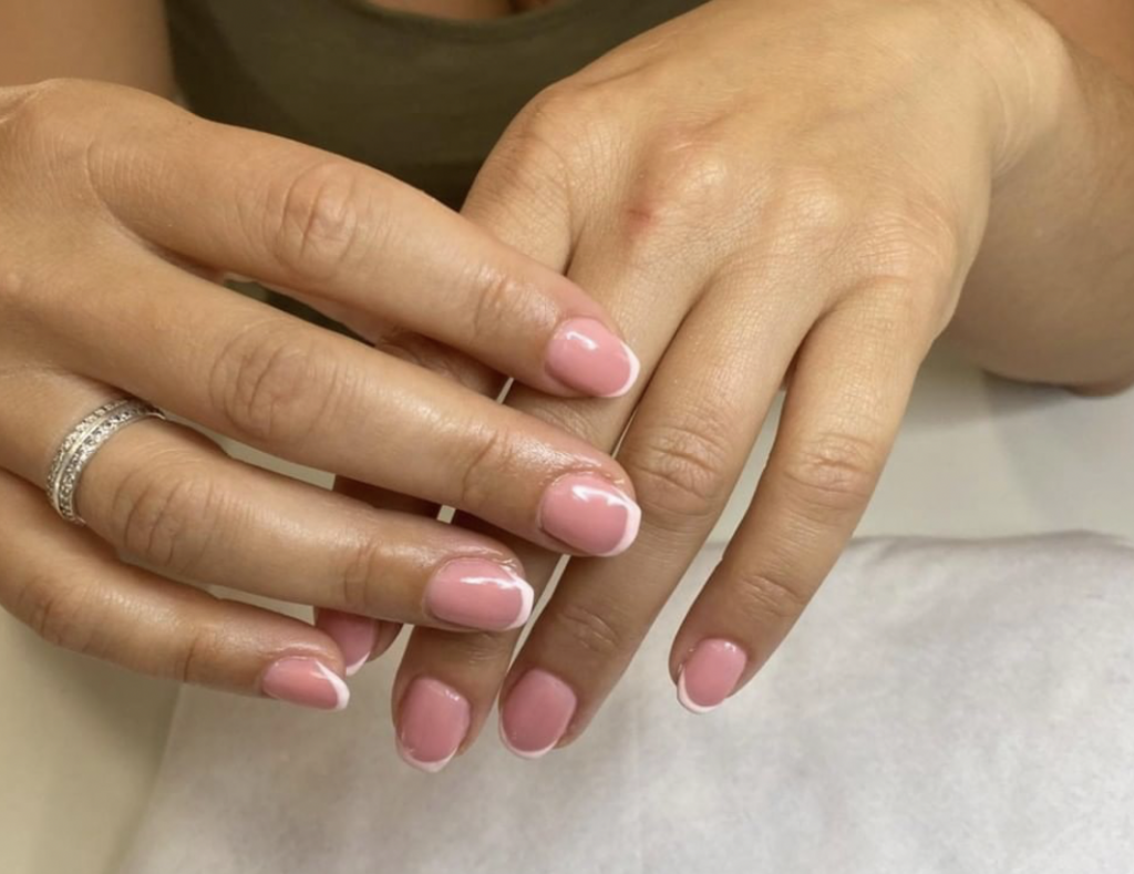Pink nails with a white tip done at our Peterborough salon